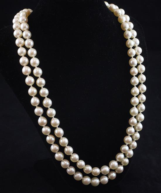 A double strand cultured pearl necklace with white gold, sapphire and diamond set clasp, 19.5in.